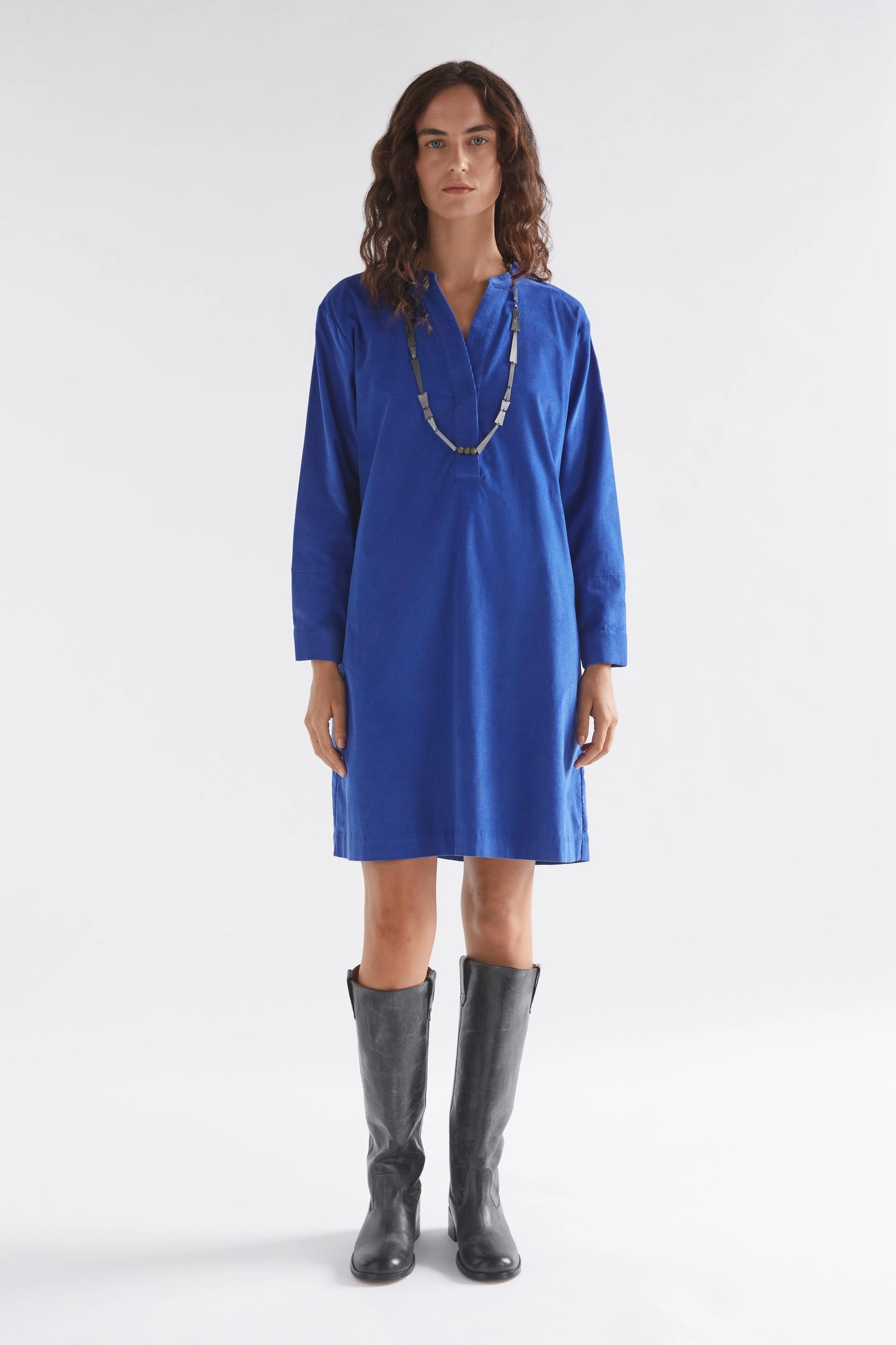 Luna Collection Above-knee cord dress Ultramarine Blue Half placket sits apart at the neck Dropped shoulder Twin needle stitching details on back yoke and forearm Fine cord fabric is soft and warm to the touch