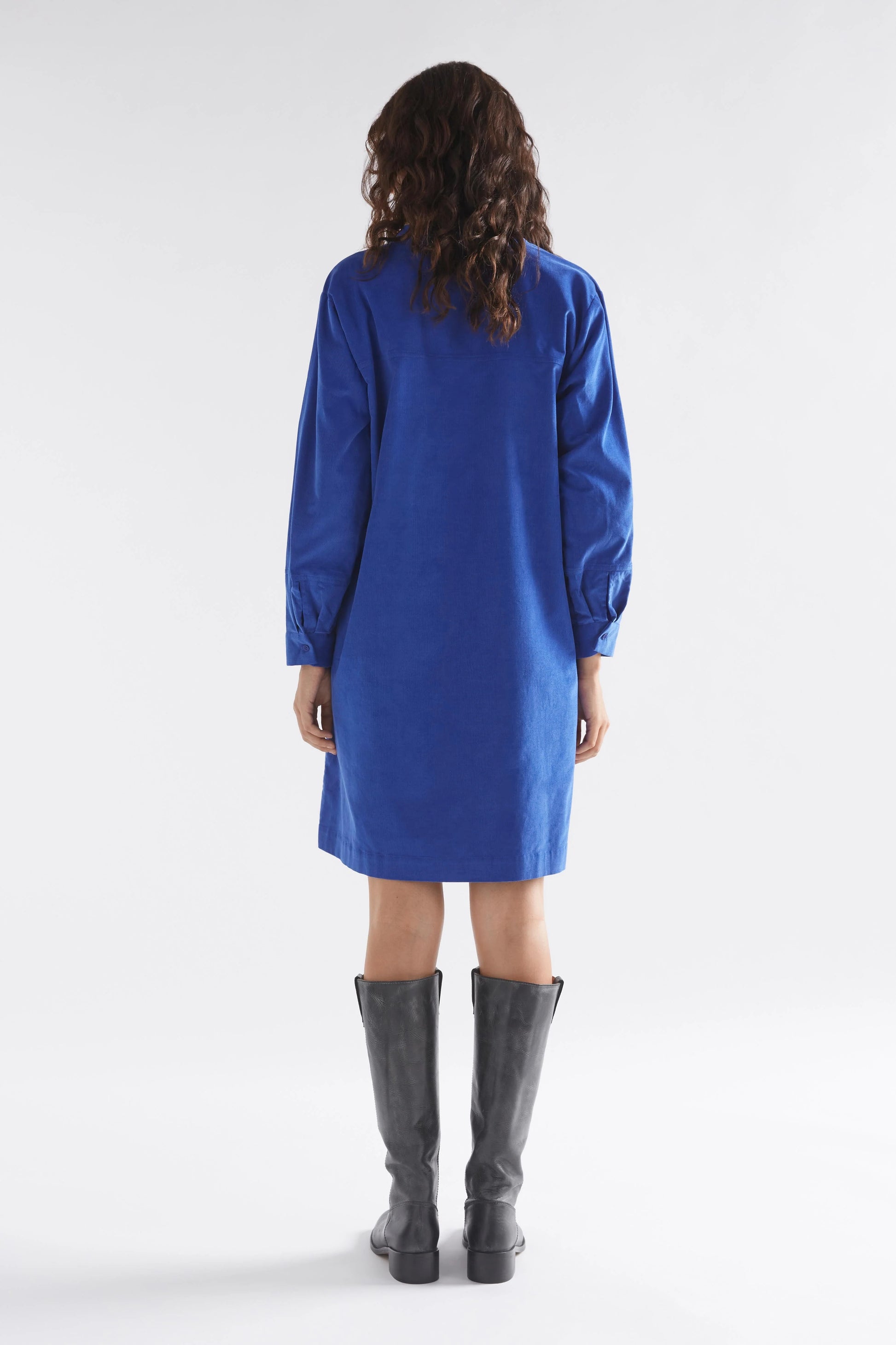 Luna Collection Above-knee cord dress Ultramarine Blue Half placket sits apart at the neck Dropped shoulder Twin needle stitching details on back yoke and forearm Fine cord fabric is soft and warm to the touch