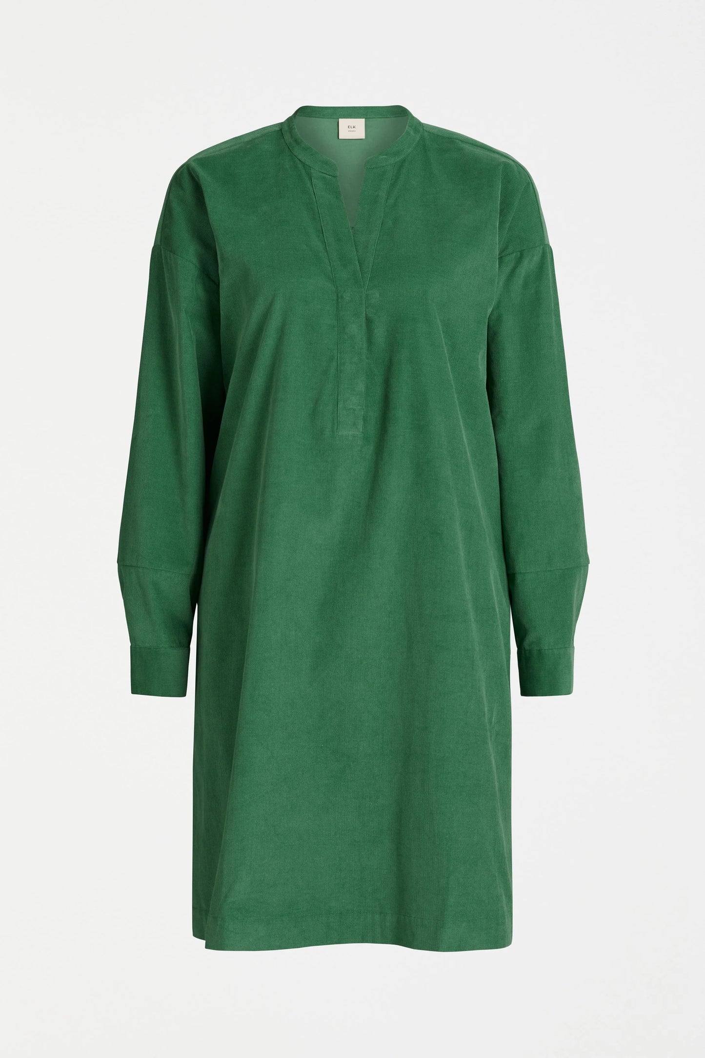 Luna Collection Above-knee cord dress Green Half placket sits apart at the neck Dropped shoulder Twin needle stitching details on back yoke and forearm Fine cord fabric is soft and warm to the touch