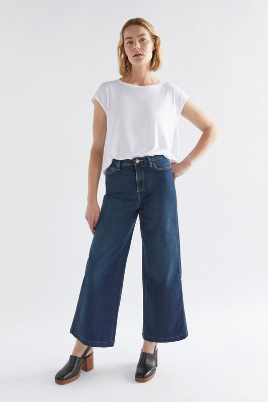 The Elk Tovi Regen Denim Jean is a five-pocket jean with a wide leg opening. With a high-rise waist, this denim jean has a slight stretch to it while retaining structure.